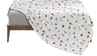 christmas fleece sheets on a bed