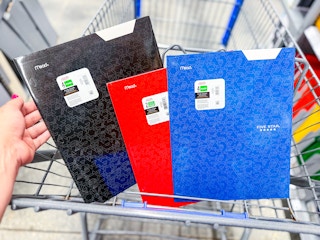 black, red, and blue Five Star folders in a Walmart cart