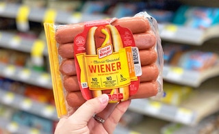 person holding pack of Oscar Mayer weiner