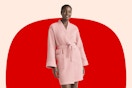 Woman wearing the coral colored Joyspun Women's Waffle Kimono Short Wrap Robe