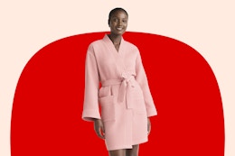 Woman wearing the coral colored Joyspun Women's Waffle Kimono Short Wrap Robe