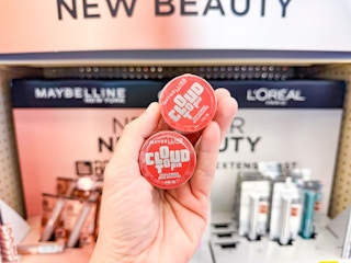 hand holding two maybelline cloudtopia blushes