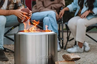 people gathered around a Solo Stove fire pit