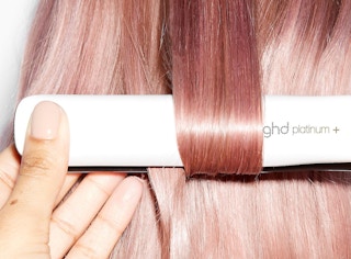 Hair straightener in pink hair