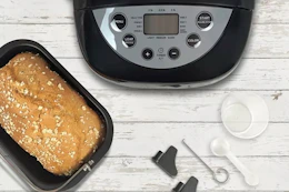 a bread maker next to fresh bread