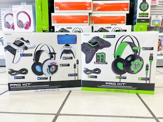 A variety of Bionik accessory kits sitting on a store floor next to each other.