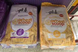 large bags of cat litter on a shelf