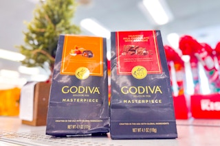 2 bags of godiva masterpiece chocolates on a shelf