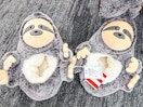 target sloth slippers sitting on the ground at target