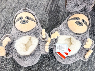 target sloth slippers sitting on the ground at target