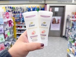 hand holding dove deodorants in walgreens