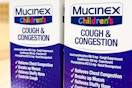 Two Mucinex Children's Cold Medicine side-by-side (close up)