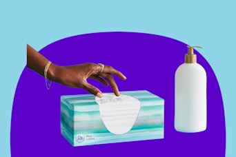A hand reaches for a Puffs with lotion tissue from a 124 count box. A brandless lotion bottle is beside it