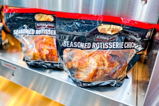 A hot shelf of bagged rotisserie chickens inside Costco.