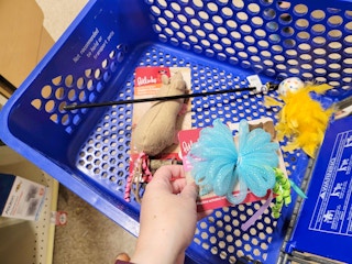 Cart at PetSmart featuring three clearance cat toys