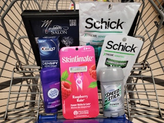 razor packs, deodorant, and toothpaste in Kroger shopping cart