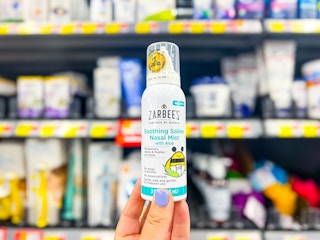 Zarbees Nasal Mist held up in front of similar items at Walmart