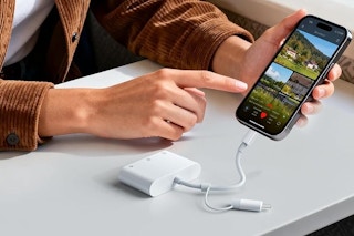 a woman using an sd card reader