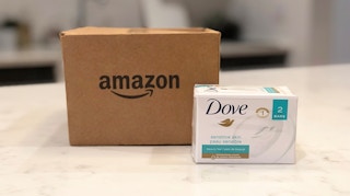 A box of Dove soap in front of an Amazon delivery box