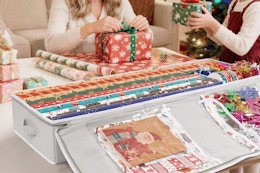 a woman and girl using a wrapping paper organizer