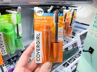 hand holding covergirl lash blast mascara