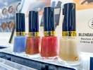 four revlon nail polishes on shelf