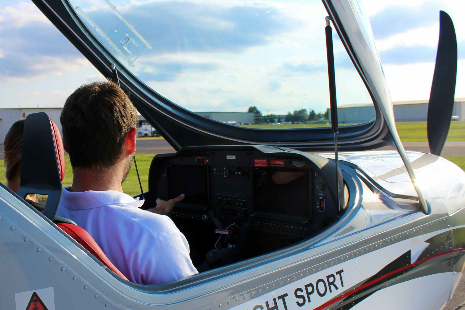 Flight instructor giving instruction to student in Michigan