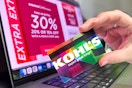 someone holding a kohls credit card