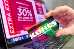someone holding a kohls credit card