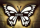 a butterfly lamp on a wall
