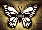 a butterfly lamp on a wall