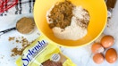 a package of splenda on a counter next to baking items in a bowl