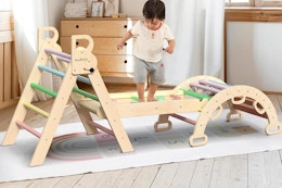 child playing on pikler triangle set