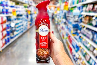 hand holding a febreze air freshener spray