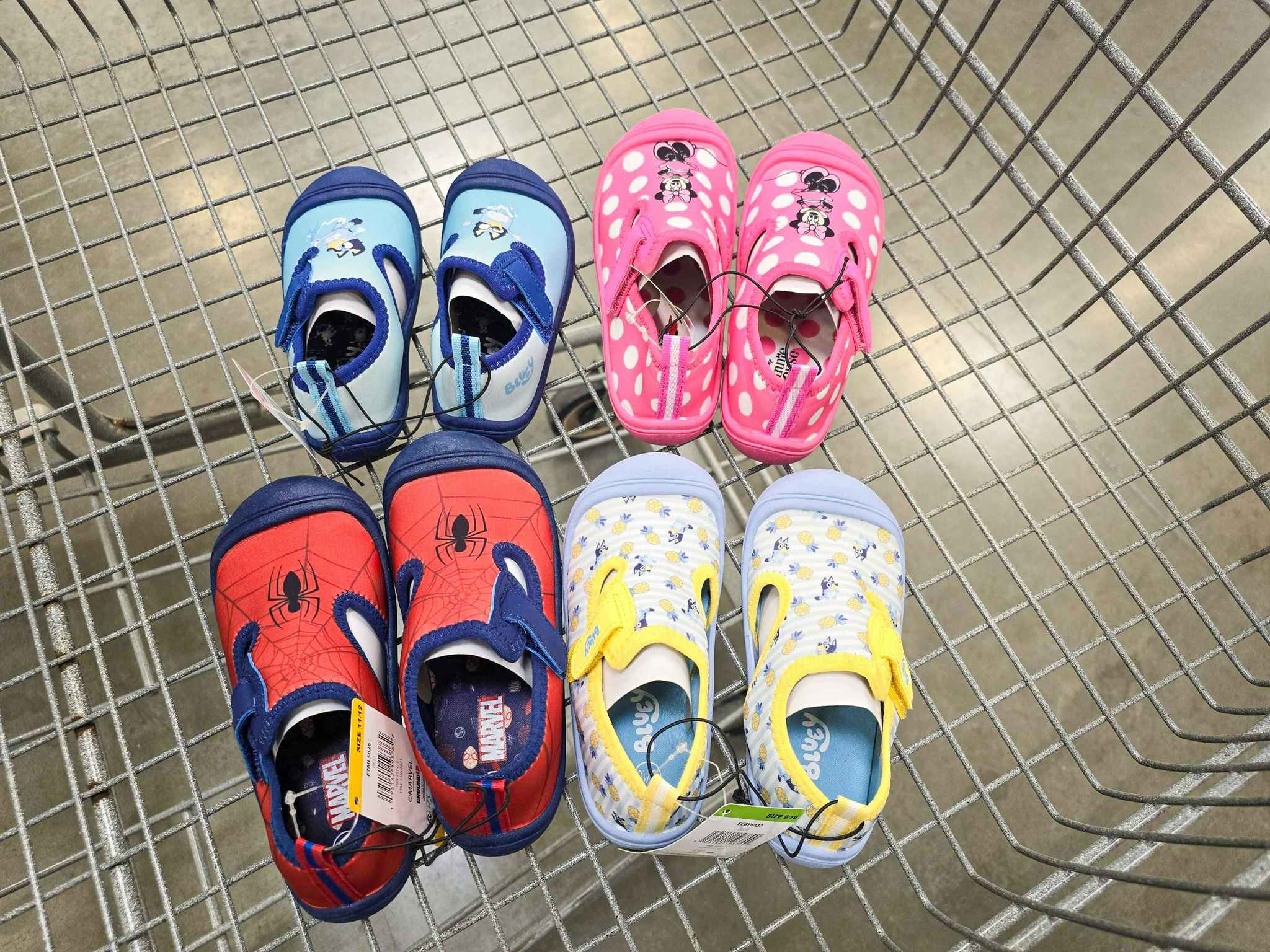 four pairs of character water shoes in a cart
