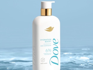 a bottle of body wash sitting in water