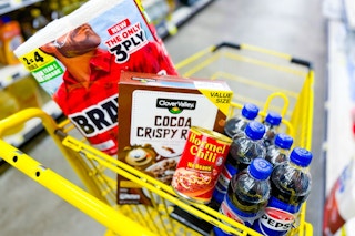 groceries in a yellow shopping cart