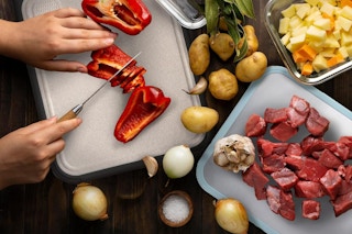 a cutting board with food