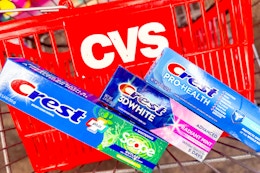 cvs basket and three tubes of crest toothpaste