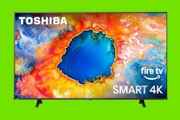 a toshiba tv on a green background