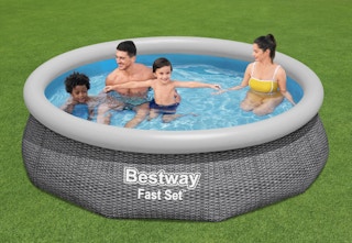 a family swimming in a Bestway pool