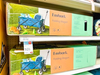 a dark blue Embark folding wagon on the shelf