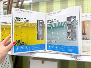 hand grabbing a box of led string lights off a target shelf