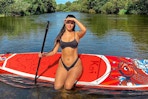 woman sitting on paddle board