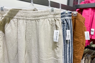 linen pants on hangers in store at old navy