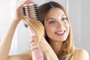 LANDOT Hair Blow Dryer Brush: One-Step Hot Air Brush with 60mm Oval Barrel being used by a woman.