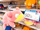 hand holding a pokemon plush at target