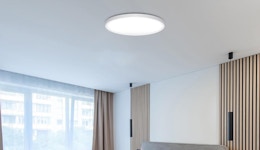 a flush mount light on a ceiling in a room
