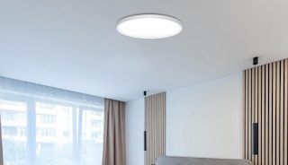 a flush mount light on a ceiling in a room