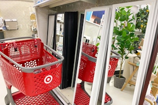 full-length mirrors on a shelf with a target cart parked in front